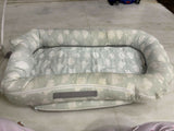 Mothercare Baby Cocoon with soft cushioned fabric, snug wrap design, and cozy support to keep newborns comfortable during sleep, rest, and travel.