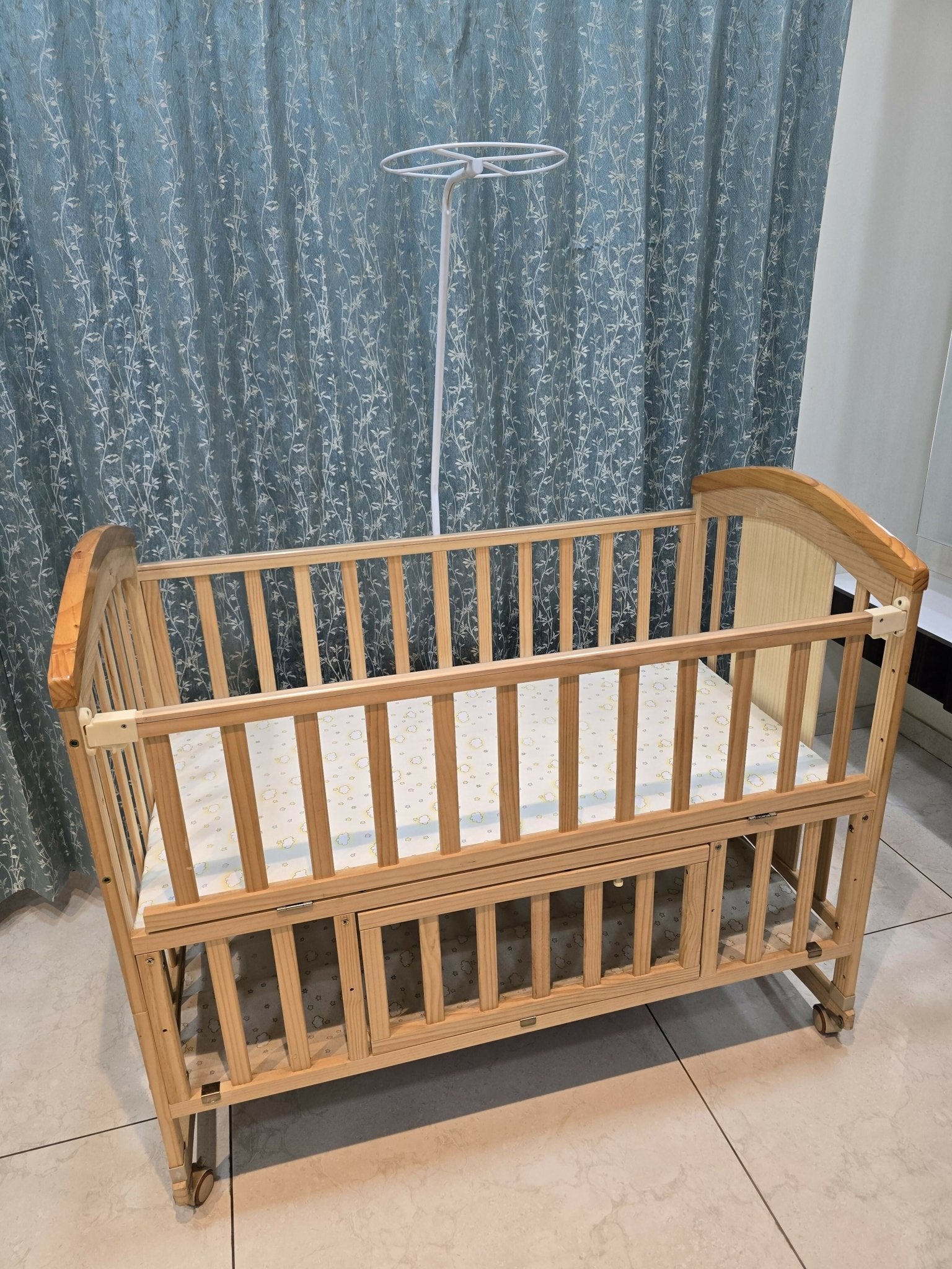 BabyTeddy® 16-in-1 original patented baby crib with convertible cot, toddler bed, cradle rocker, study desk, kids' sofa mode, mosquito net, soft mattress, and diaper changing station for newborns and growing children.