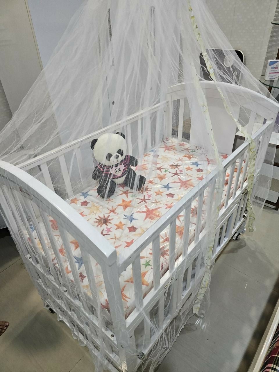 HUNYHUNY 15-in-1 pinewood cot crib with mattress and mosquito net, featuring sturdy wooden construction, convertible design, comfortable sleeping space, and secure support for babies.