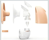 Breast pump with clear container on a white background