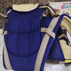 NOVELTY 4 in 1 Baby Carrier in Almost New condition featuring multiple carrying positions, adjustable straps, padded support, secure fastening, and a practical hands-free design for comfortable everyday baby carrying.