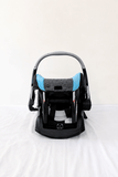 Evenflo Embrace infant car seat with base, rear-facing design, cushioned newborn support, secure safety harness, and portable baby carrier functionality for safe travel.
