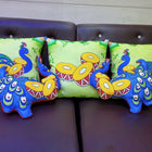 Colorful peacock-patterned cushions 