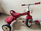 RADIO FLYER tricycle with sturdy construction, comfortable seat, easy-grip handlebars, smooth wheels, and child-friendly design for outdoor play and riding adventures.