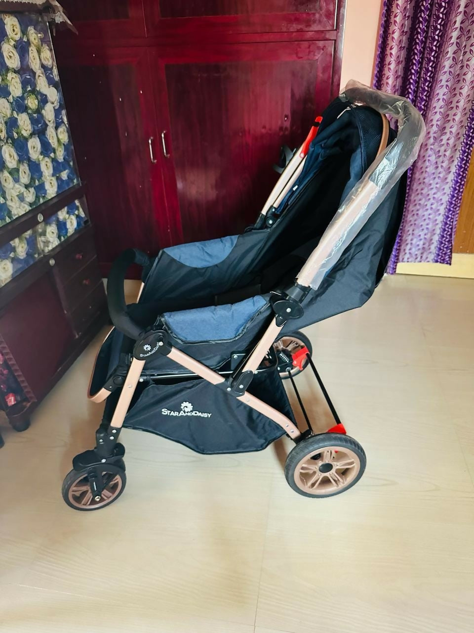 Experience comfort and convenience with the STAR AND DAISY Stroller/Pram for Baby, featuring a spacious seat, adjustable canopy, and one-hand folding mechanism for easy travel and storage.