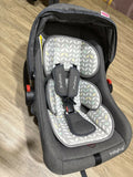 Gray baby car seat with patterned cushion 
