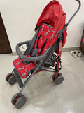 POLKA TOTS baby stroller with 5-point safety harness, adjustable canopy, storage basket, lightweight umbrella-fold design, and smooth wheels for babies and toddlers up to 20 kg (0–5 years).