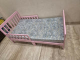 POLKA TOTS SideSnug toddler baby bed in pink with soft cushioned design, protective side bolsters, cozy sleeping space, and comfortable support for toddlers and young children.