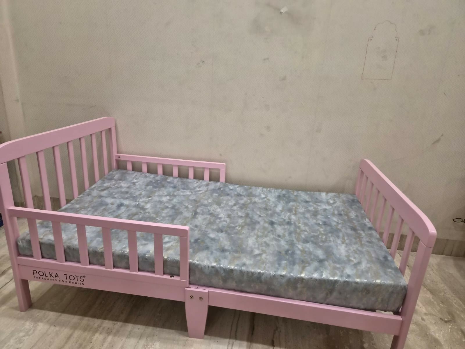POLKA TOTS SideSnug toddler baby bed in pink with soft cushioned design, protective side bolsters, cozy sleeping space, and comfortable support for toddlers and young children.