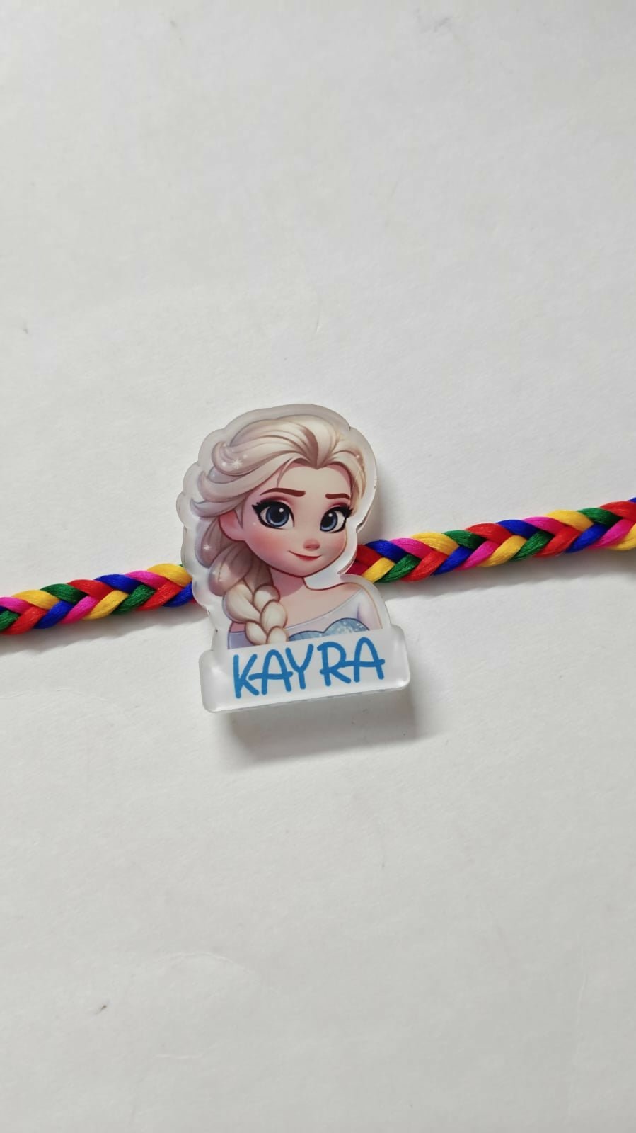 Personalized kids Rakhi featuring a custom name design, soft child-friendly materials, colorful embellishments, and a comfortable thread for celebrating Raksha Bandhan.