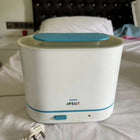 Philips Avent 3-in-1 Electric Steam Sterilizer with adjustable size configuration, natural steam sterilization, and spacious capacity for baby bottles, breast pump parts, pacifiers, and feeding accessories.