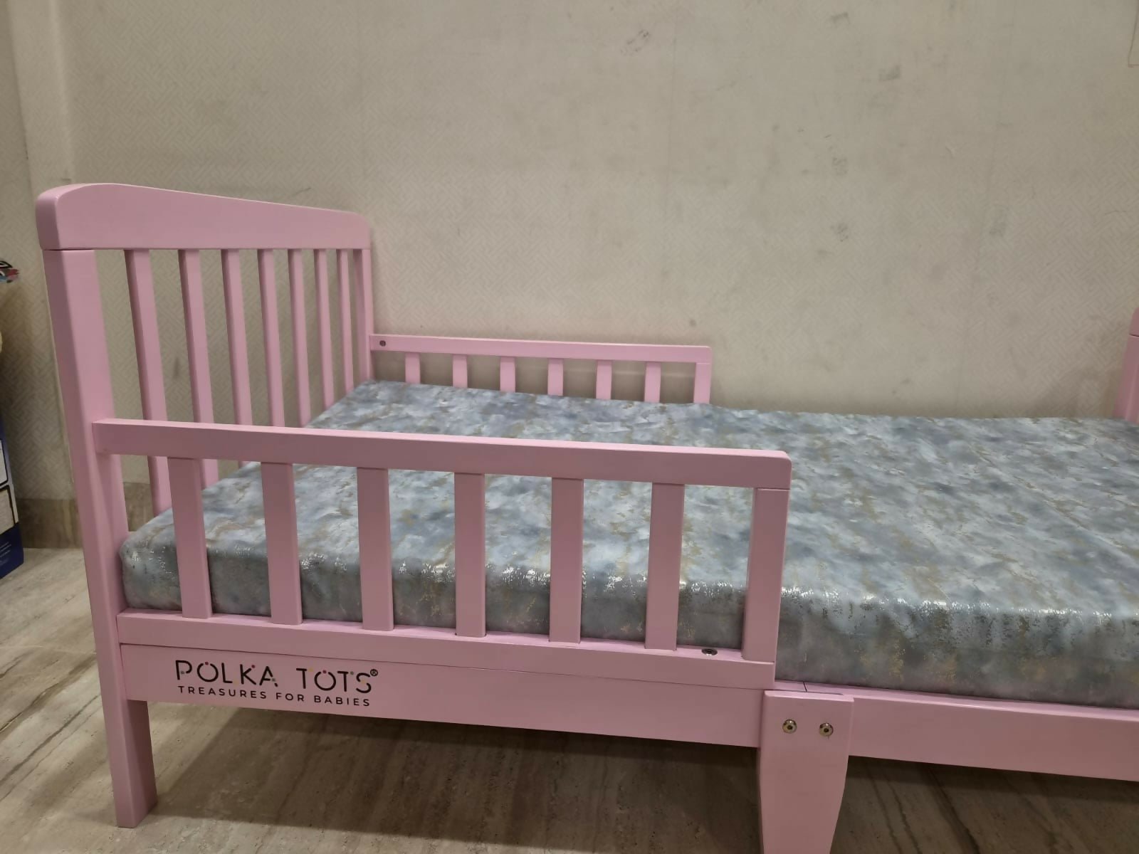 POLKA TOTS SideSnug toddler baby bed in pink with soft cushioned design, protective side bolsters, cozy sleeping space, and comfortable support for toddlers and young children.