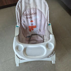 MISS & CHIEF Portable Baby Rocker & Bouncer with a comfortable padded seat, gentle rocking motion, safety harness, sturdy frame, and lightweight foldable design for babies.