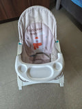 MISS & CHIEF Portable Baby Rocker & Bouncer with a comfortable padded seat, gentle rocking motion, safety harness, sturdy frame, and lightweight foldable design for babies.