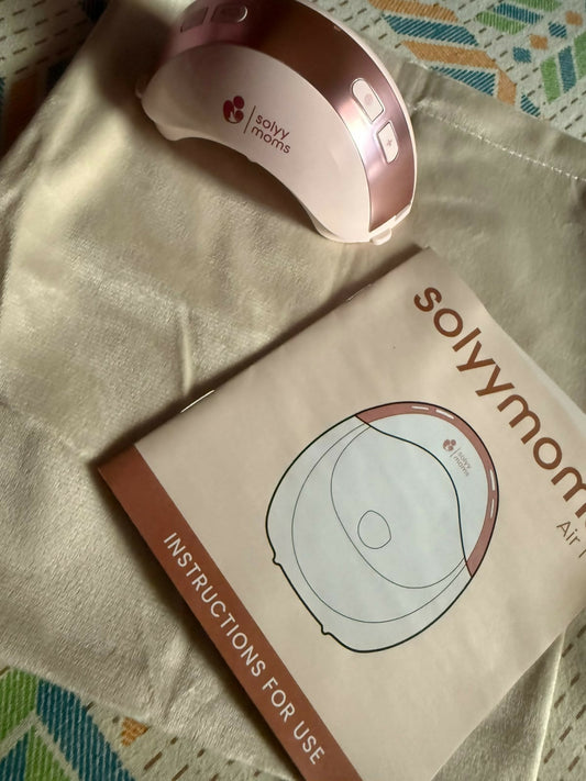 SOLYYMOMS Smart Wearable Breast Pump in Preloved New condition featuring a compact hands-free design, adjustable pumping settings and comfortable fit for convenient breast milk expression at home, work or while travelling.
