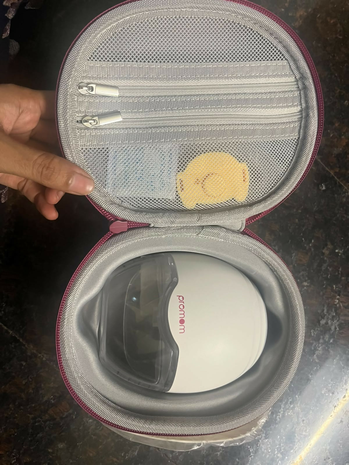 Pro Mom Wearable Breast Pump with a hands-free, compact design, adjustable suction settings, discreet in-bra fit, rechargeable operation, and milk collection cup for convenient pumping at home or on the go.