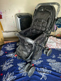 BABYHUG Cocoon stroller with mosquito net, reclining seat, safety harness, protective canopy, smooth wheels, and comfortable travel design for babies.