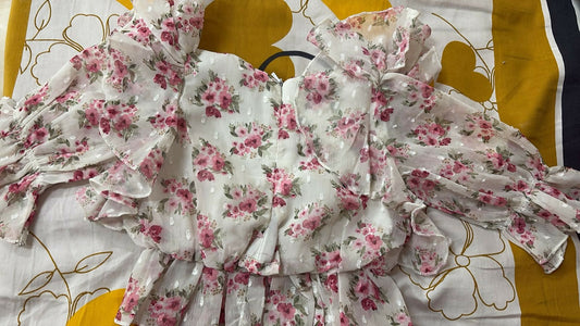Floral dress with pink flowers on a white background