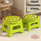 Two green folding stools 