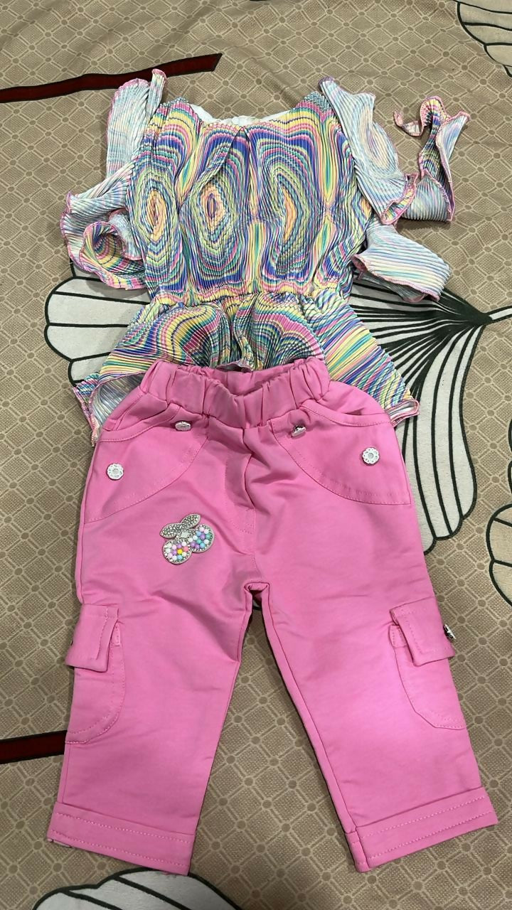 Colorful patterned top and pink pants 