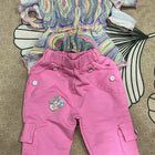 Colorful patterned top and pink pants 