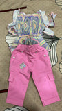Colorful patterned top and pink pants 