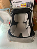 R for Rabbit Cozy Carry Cot/Car Seat with rear-facing design, cushioned seating, ergonomic carry handle, 5-point safety harness, and protective canopy for safe and comfortable travel with newborns and infants.