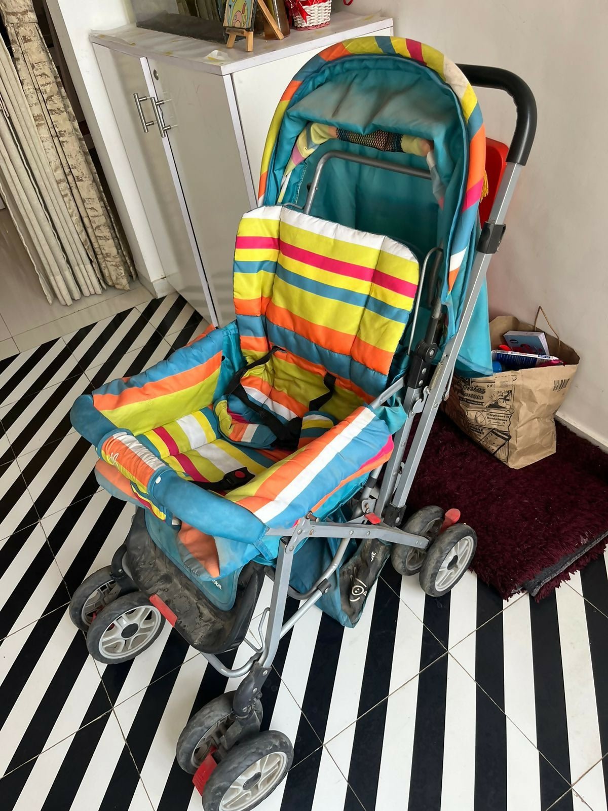 R for Rabbit Lollipop Lite baby stroller/pram with a lightweight foldable design, reclining seat, adjustable canopy, 5-point safety harness, smooth wheels, and storage basket for comfortable travel with babies and toddlers.