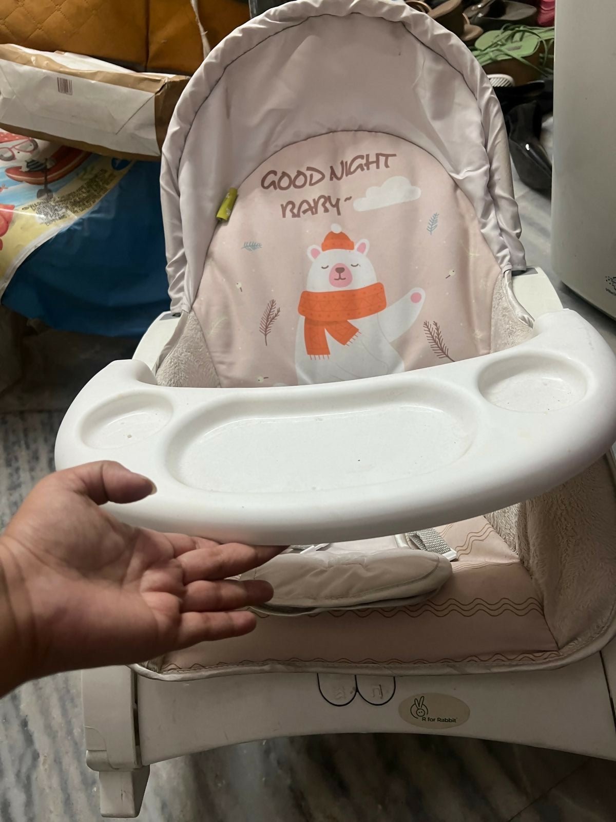 R for Rabbit Rock n Play baby rocker with a cushioned seat, gentle rocking motion, secure safety harness, and sturdy frame for soothing, relaxing, and entertaining newborns and infants.