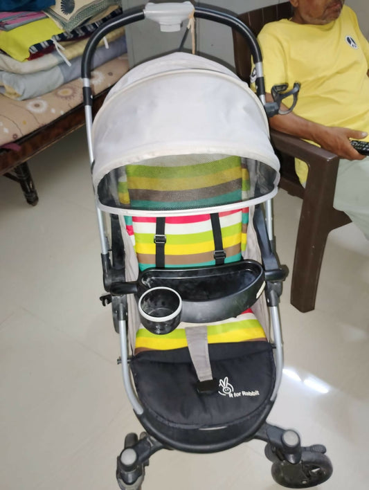 R for Rabbit Chocolate Ride toddler pram with reclining seat, foldable design, safety harness, adjustable canopy, smooth wheels, and comfortable travel support for babies and toddlers.