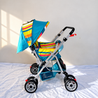 R FOR RABBIT Lollipop Lite Baby Pram B187 in Rainbow with reversible handle and reclining seat.