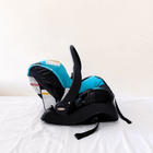 Evenflo Embrace infant car seat with base, rear-facing design, cushioned newborn support, secure safety harness, and portable baby carrier functionality for safe travel.