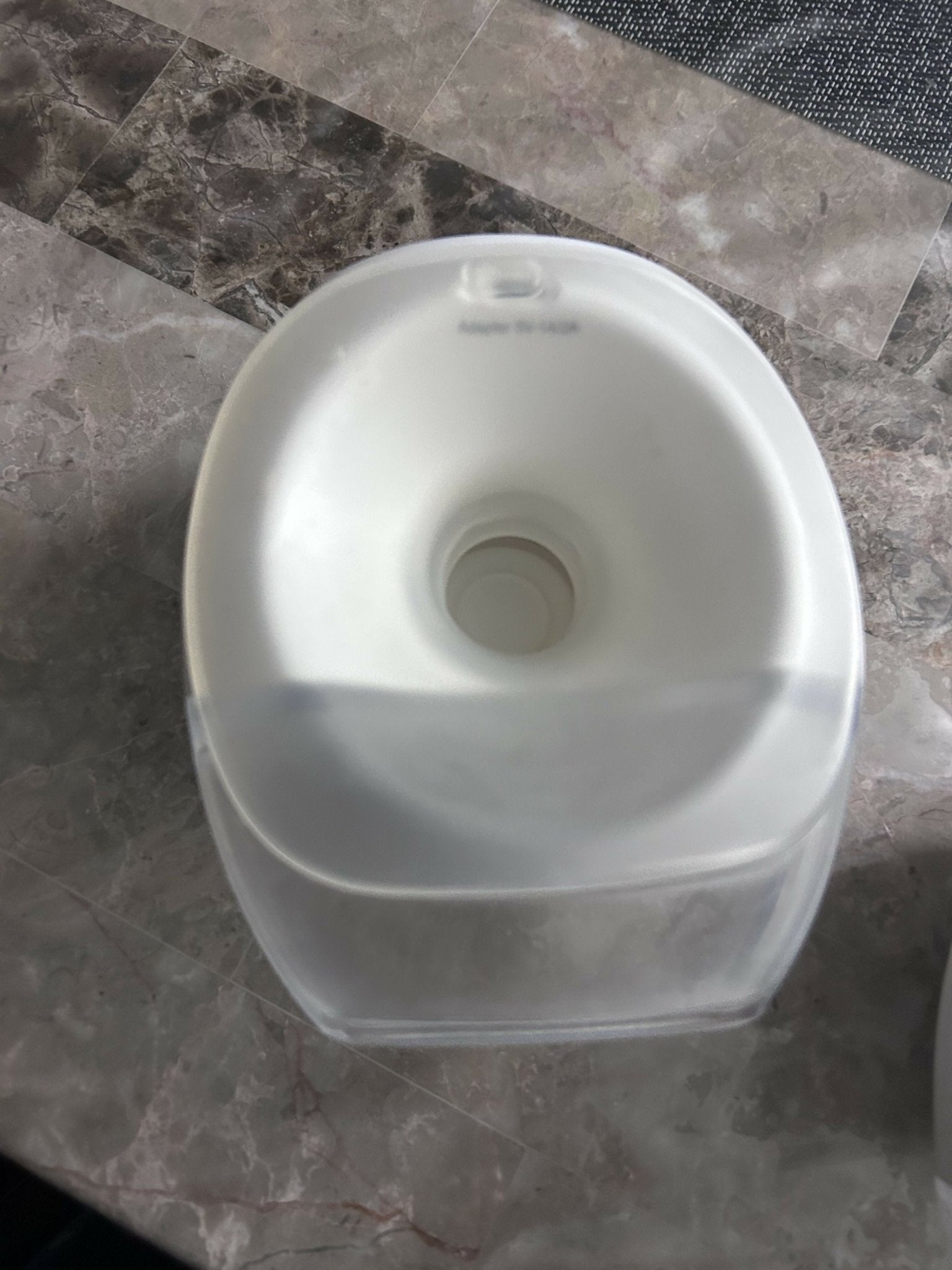 PROMOM wearable breast pump with hands-free design, adjustable suction levels, lightweight collection cups, rechargeable operation, and comfortable milk expression support for breastfeeding mothers.