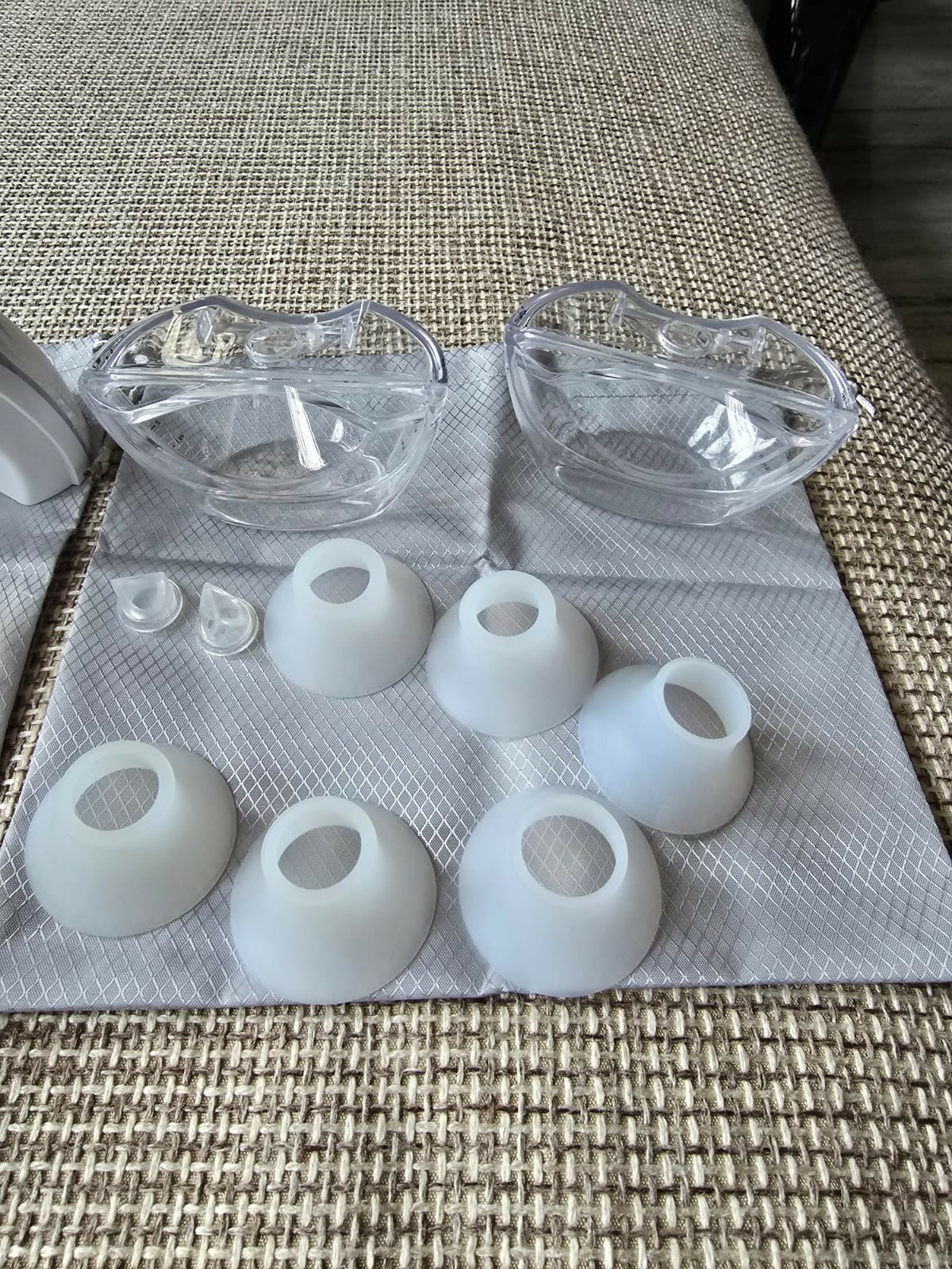 Clear glass bowls and white silicone molds on a textured surface