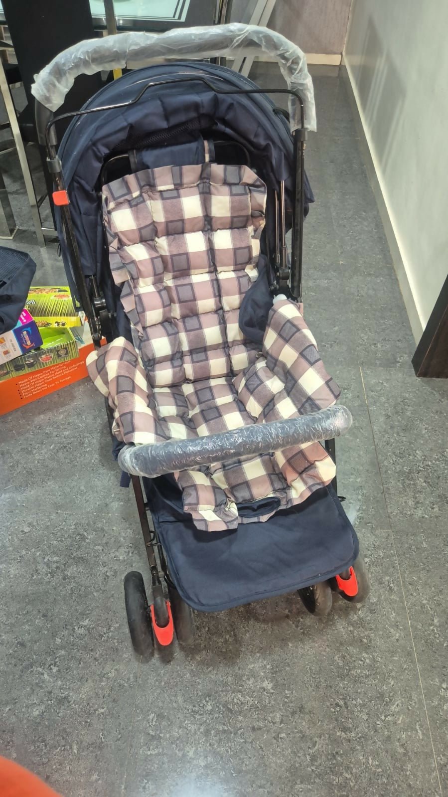 STAR AND DAISY Sunrise Baby Stroller with adjustable canopy, padded seat, and sturdy wheels in a modern design.