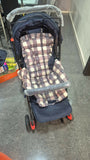 STAR AND DAISY Sunrise Baby Stroller with adjustable canopy, padded seat, and sturdy wheels in a modern design.
