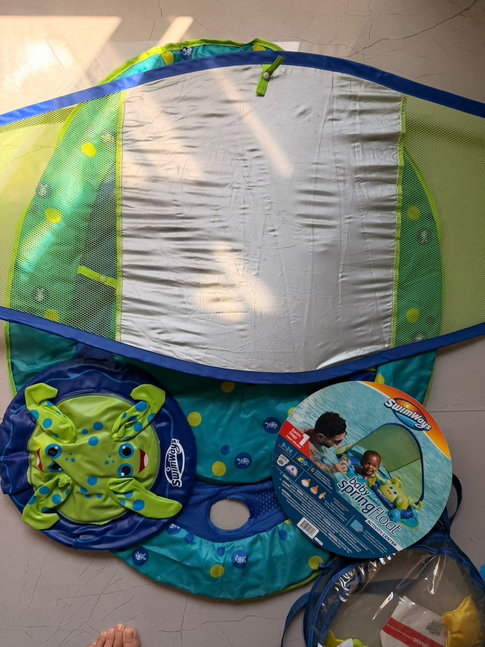 SWIMWAYS Swim Tube with Canopy for baby pool play with overhead shade.