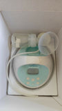 SPECTRA S-1 Plus Electric Breast Pump in White & Sky Blue with adjustable suction levels, massage mode, rechargeable battery, closed-system hygiene, and quiet operation for comfortable milk expression.