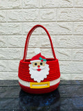 Red woven basket with a Santa Claus face 