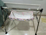 A TO Z HUB portable folding Ghodiyu traditional baby cradle with black cotton cloth, foldable metal frame, gentle rocking design, and a comfortable sleeping space for newborns and infants.