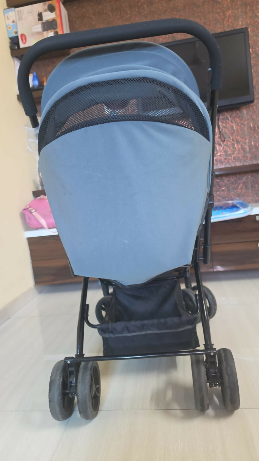 BABYHUG Symphony stroller with reversible handle, reclining seat, safety harness, adjustable canopy, smooth wheels, and comfortable travel support for babies and toddlers.