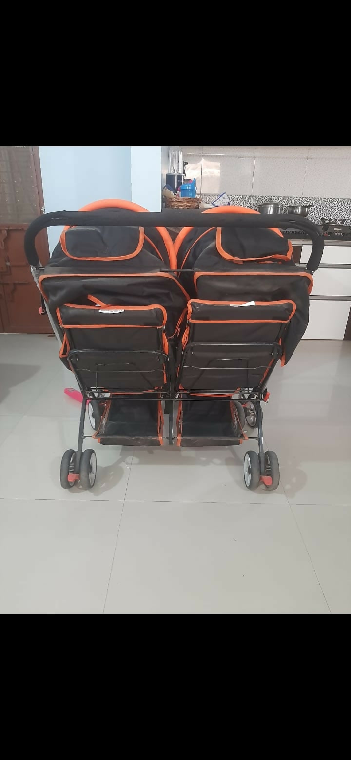 Mee Mee twin stroller pram for babies with dual seating, safety harnesses, smooth wheels, adjustable canopies, and comfortable design for outings with two children.