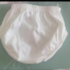 White diaper on a green surface