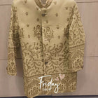 Light green embroidered blouse on a hanger with 'Friday' text on a wooden background