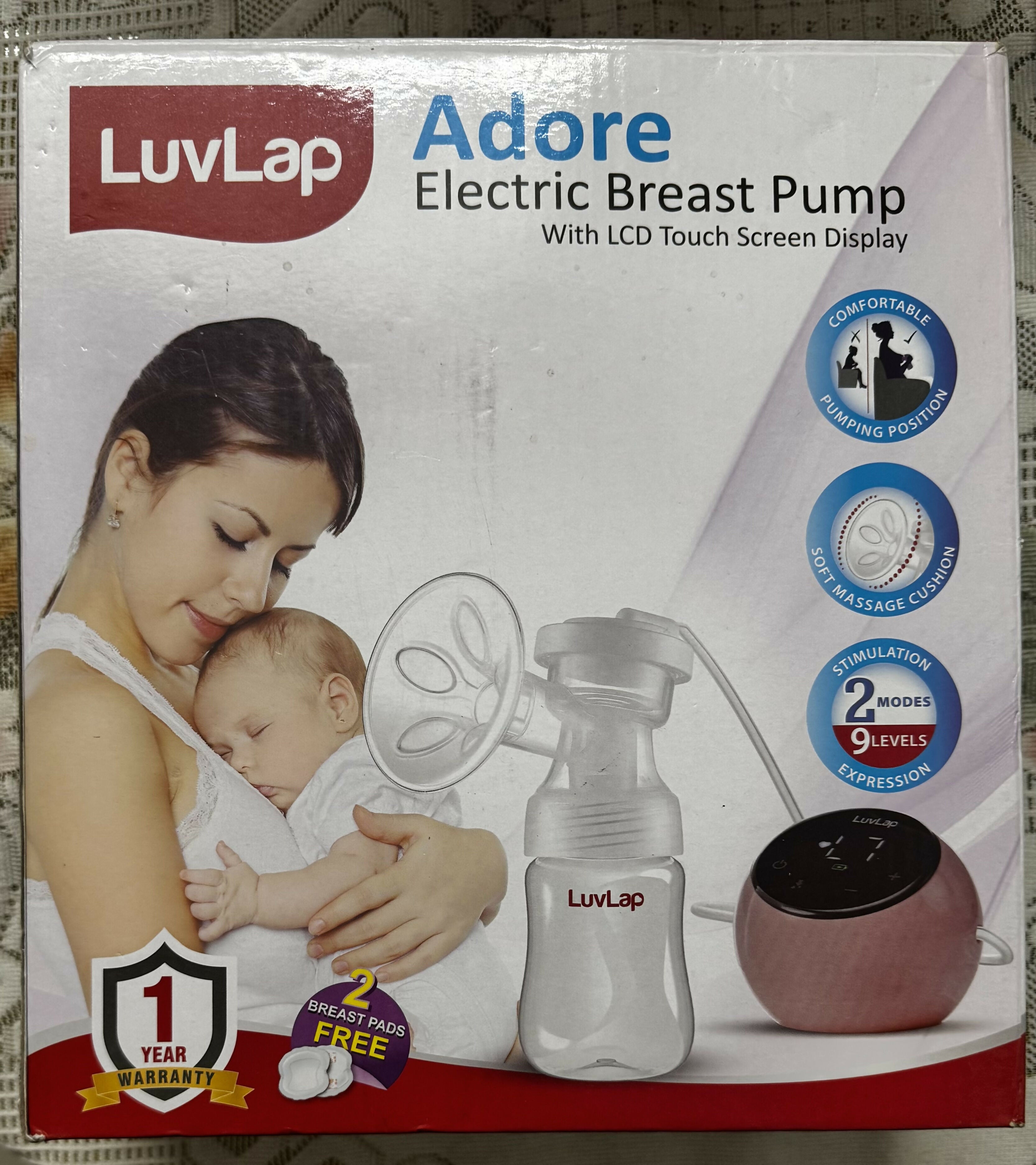 LuvLap Adore Electric Breast Pump packaging with a woman holding a baby