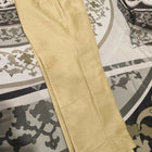 Beige pants on a patterned rug