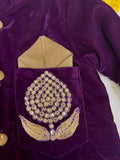 Elegant purple baby sherwani with intricate detailing, soft fabric, and comfortable fit, perfect for festive occasions and celebrations.