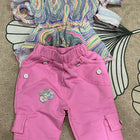 Colorful top and pink pants 