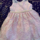 Adorn your baby girl in this elegant Pearl and Lace Work Frock, perfect for making precious memories!






