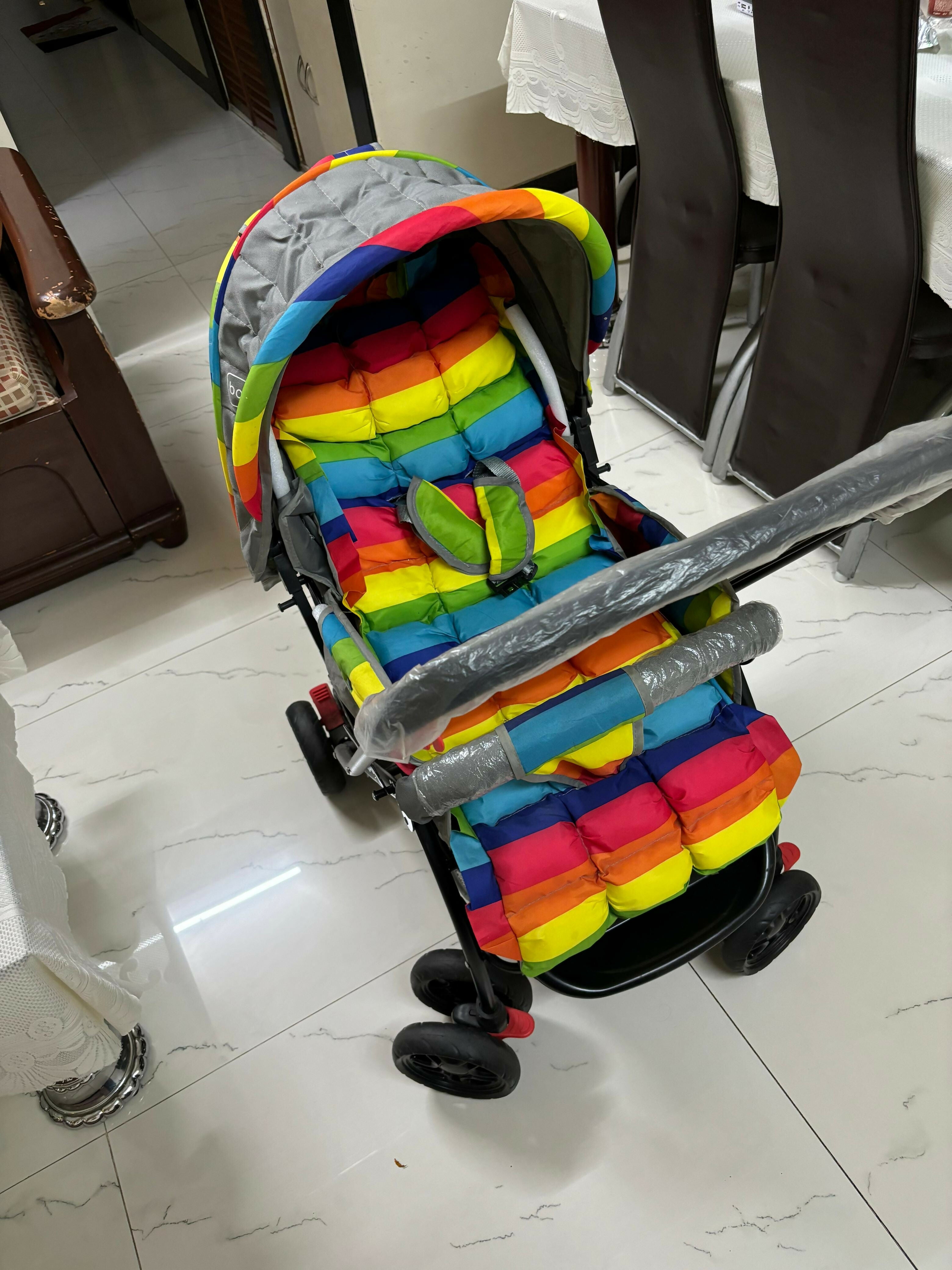 BABYHUG Cosy Cosmo Stroller/Pram with Reversible Handle offers comfort and convenience, featuring a back pocket and smooth maneuverability for your baby’s outings.

